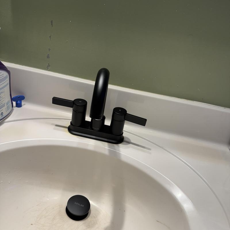 Matte black lavatory faucet on bathroom sink