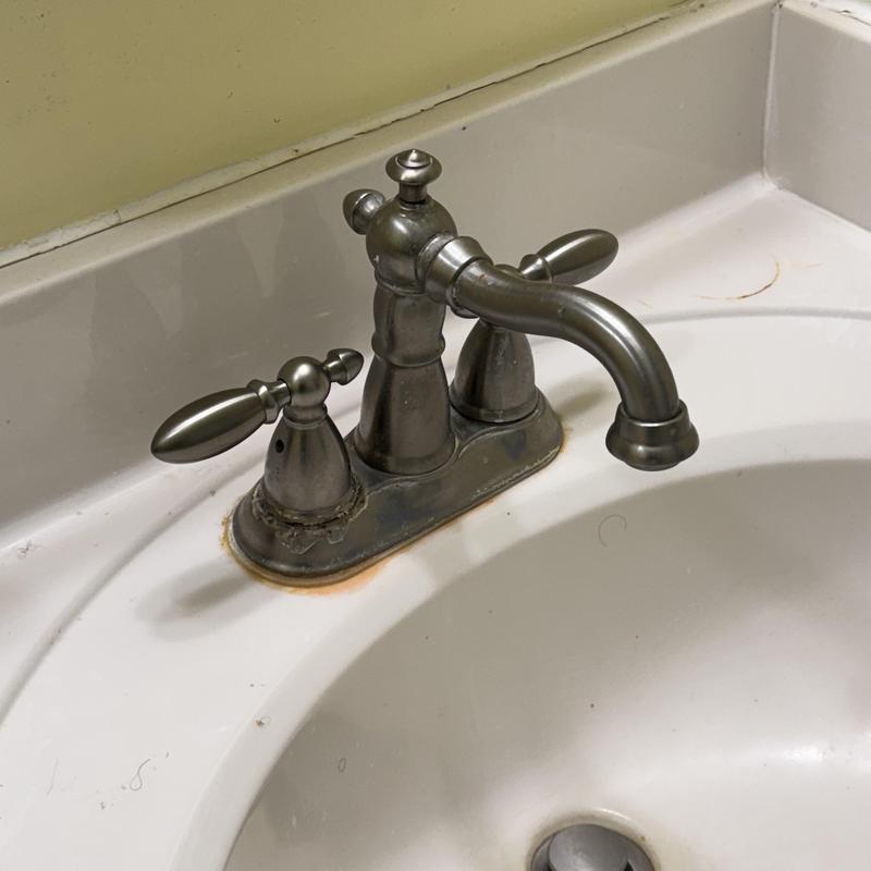 Lavatory faucet with corrosion and water stains