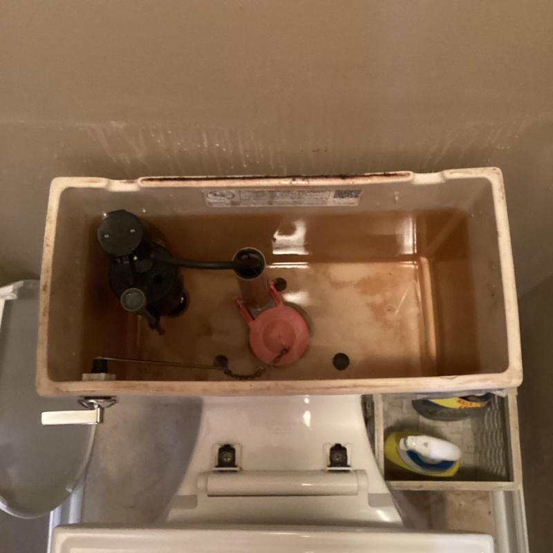 Toilet fill valve and flapper inside tank
