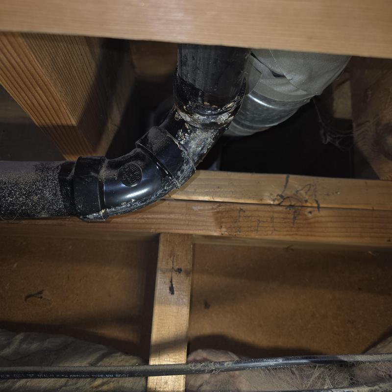 ABS drain pipe under kitchen sink with damage