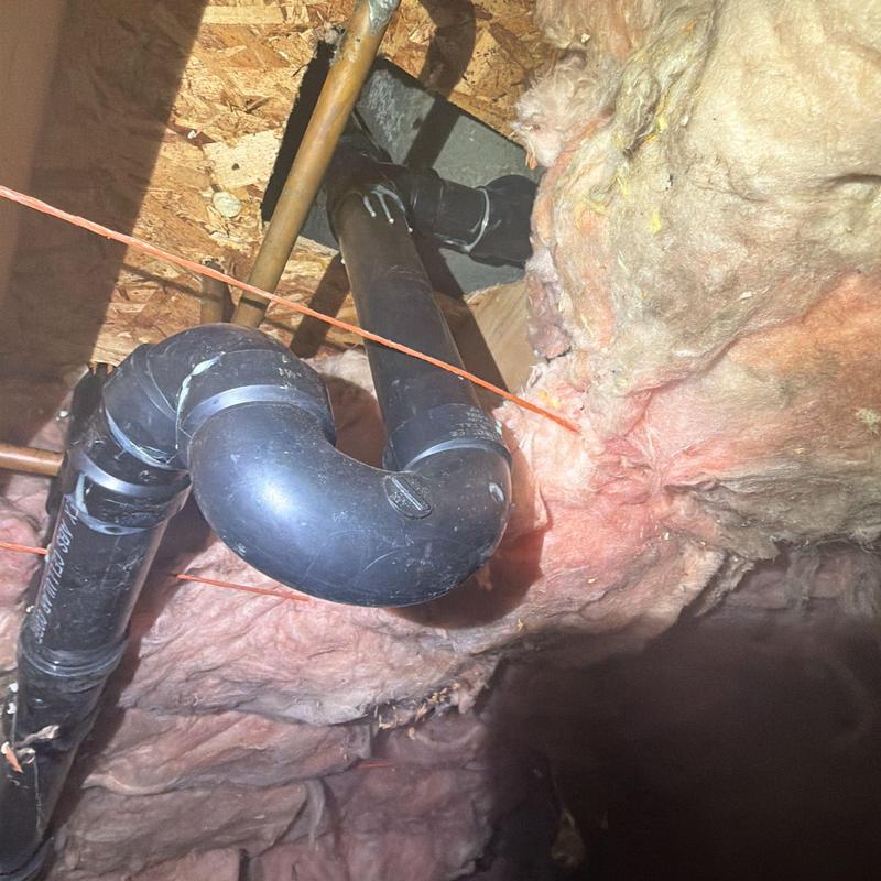 ABS waste and overflow pipe installation with insulation
