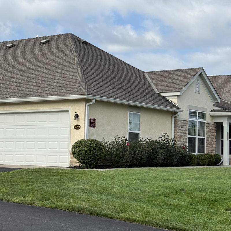 Asphalt shingle roof on suburban condo building Asphalt shingle roof on suburban condo building