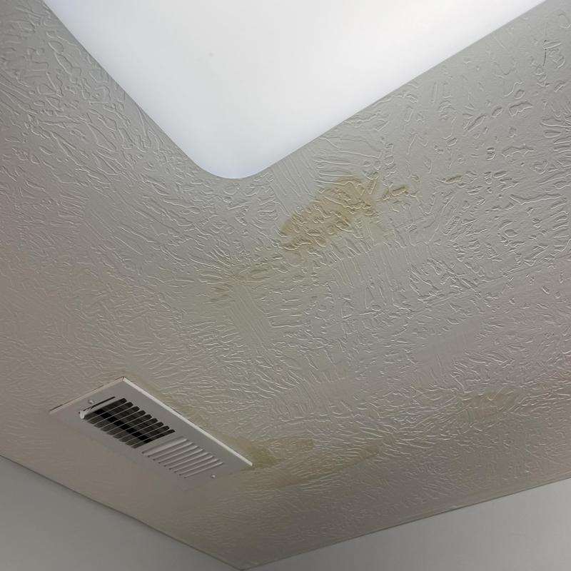 Ceiling drywall with water stains near vent and light Ceiling drywall with water stains near vent and light