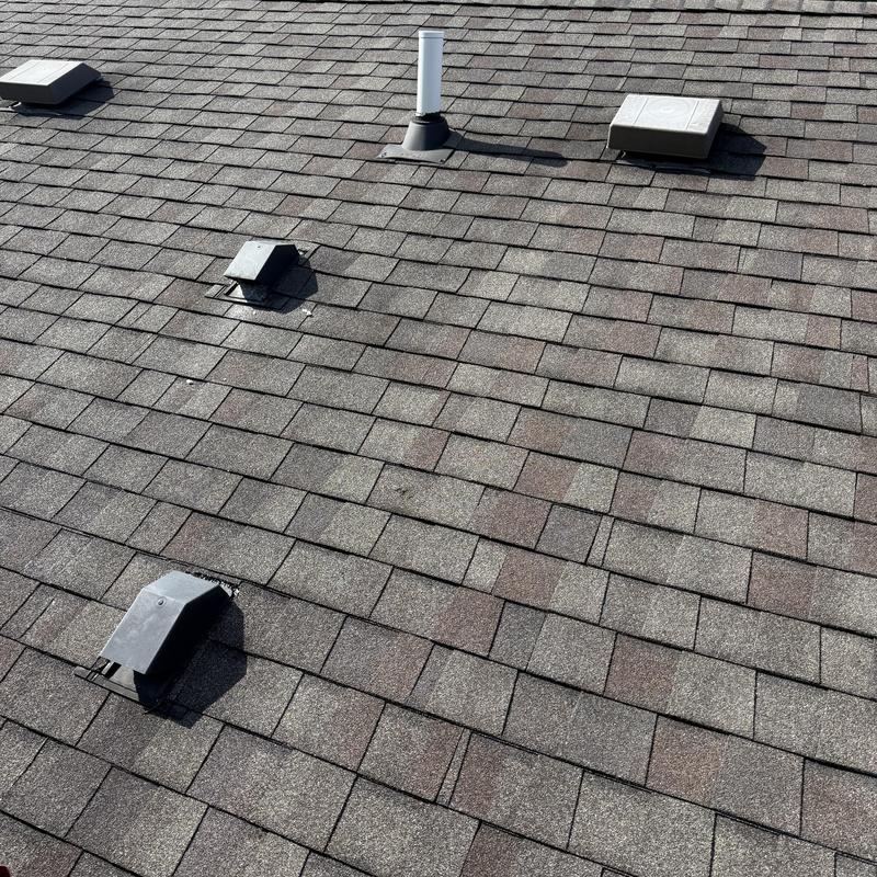 Asphalt roof shingles with vents and plumbing pipe Asphalt roof shingles with vents and plumbing pipe