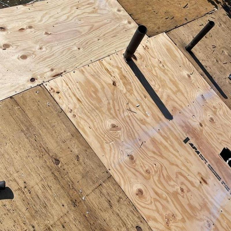 Plywood roof decking installation with plumbing vents