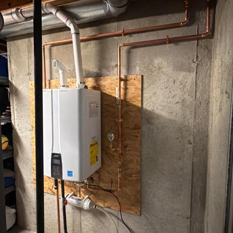 Tankless water heater with upgraded gas line and PVC exhaust Tankless water heater with upgraded gas line and PVC exhaust