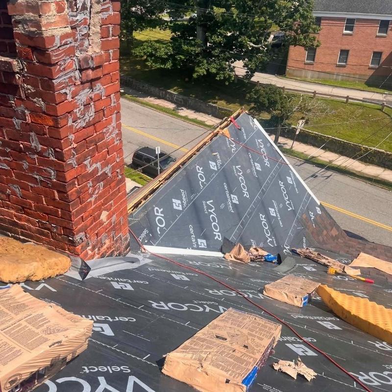 Ice and water shield underlayment on roof near chimney