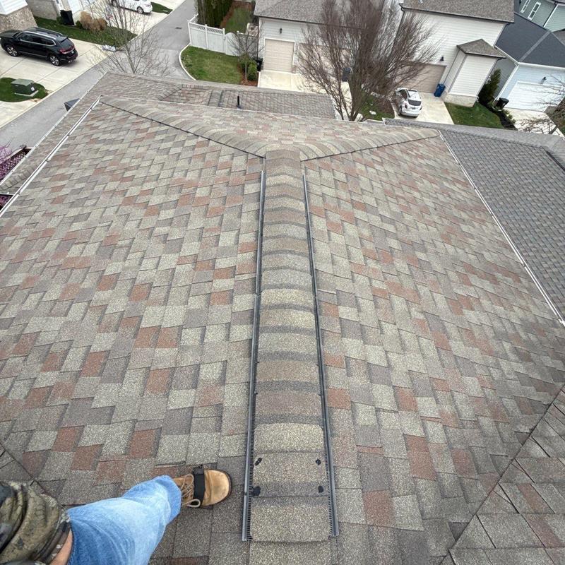 Asphalt shingle roof with ridge vent inspection