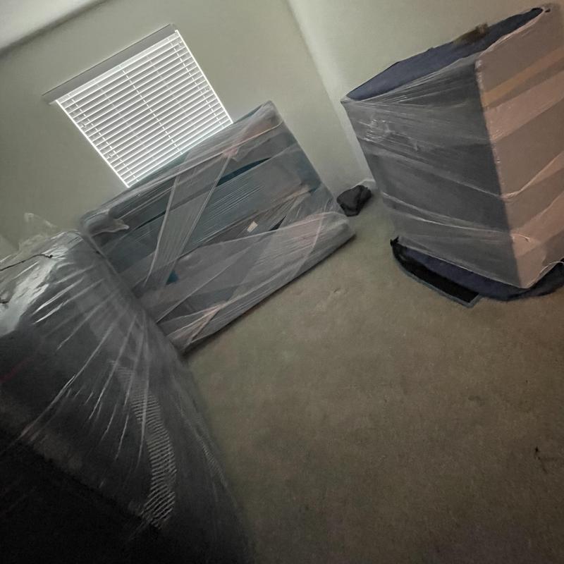 Wrapped bedroom furniture secured for house move