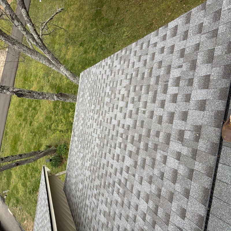 Asphalt shingle roof with visible hail damage inspection