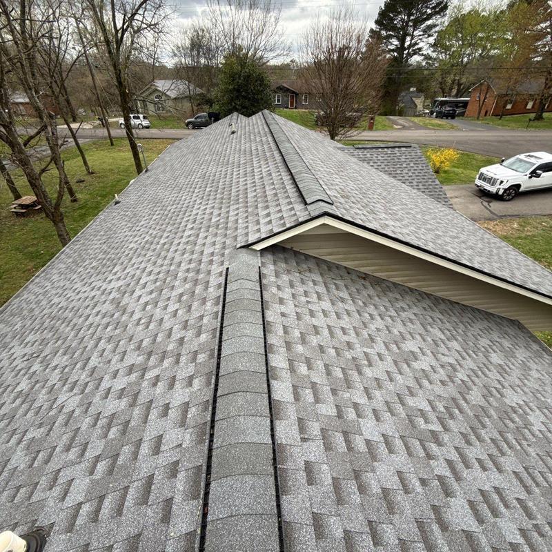 Asphalt shingle roof with hail damage inspection