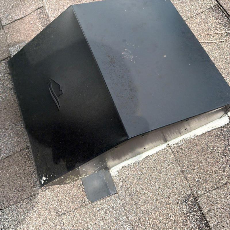 Roof vent with surface rust and shingle wear