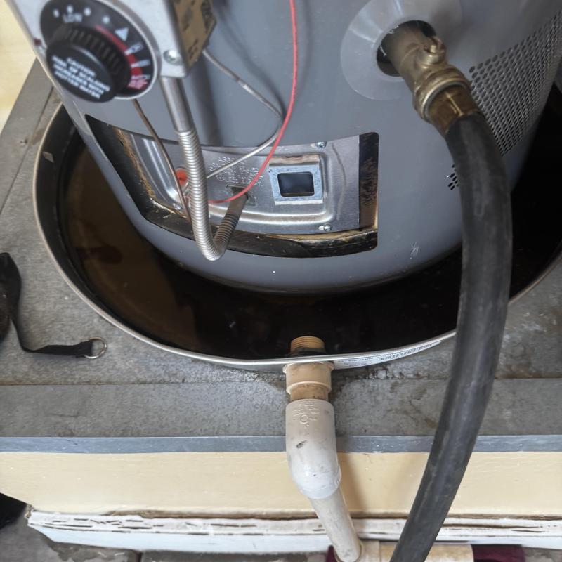 Gas water heater drain pan with connected pipes