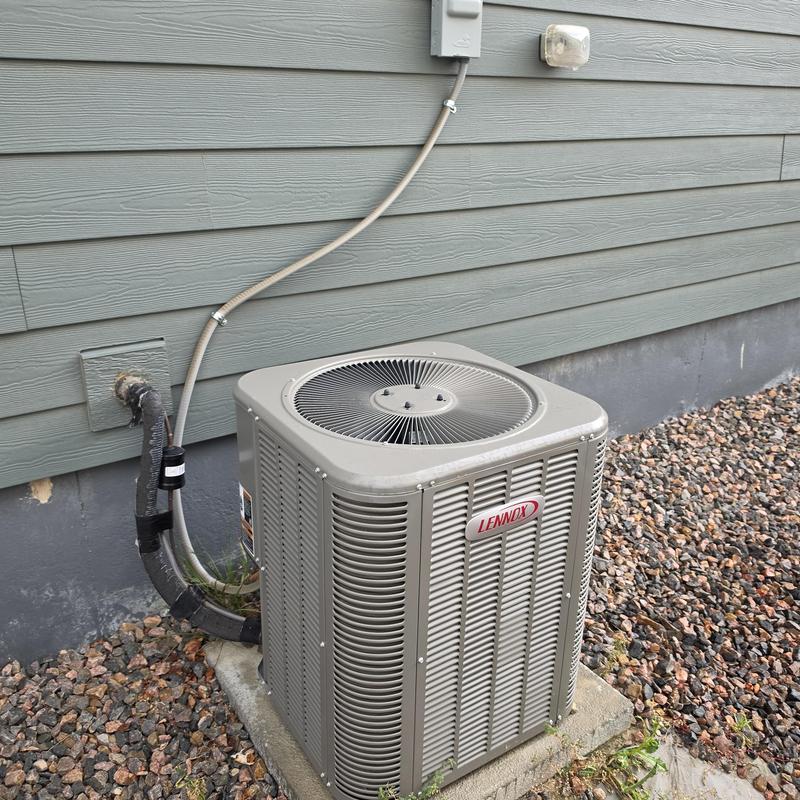 Lennox air conditioner outdoor unit on concrete pad Lennox air conditioner outdoor unit on concrete pad
