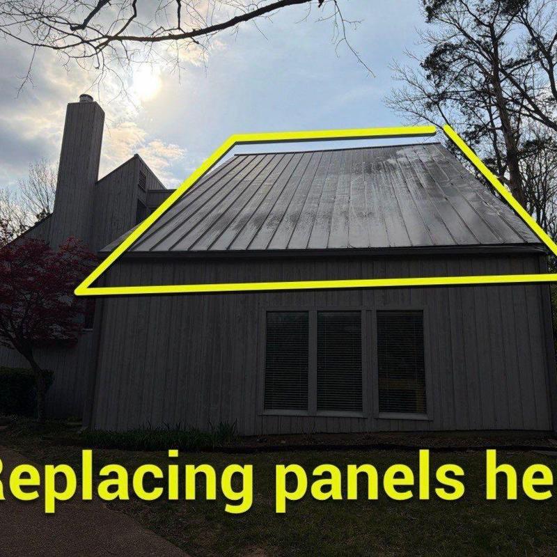 Metal roof panels with hail damage outlined in yellow