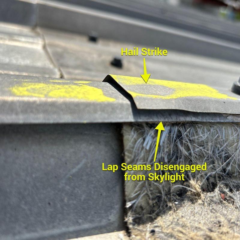 Roof skylight lap seams disengaged, hail strike damage