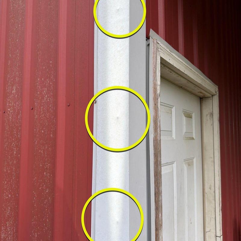 Metal siding panel with hail damage inspection circles