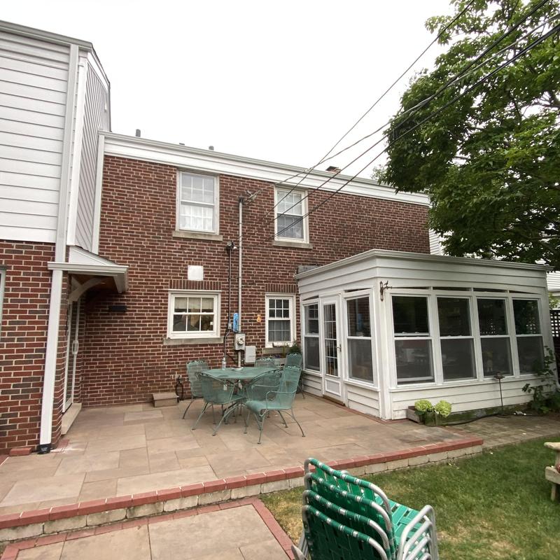 Composite insulated siding and gutter guards exterior view