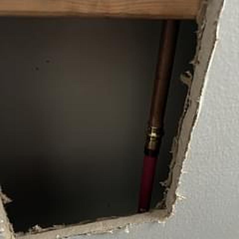 Copper water line with new pipe section behind wall Copper water line with new pipe section behind wall