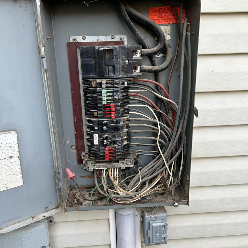 SylvaniaZinsco electrical panel with exposed wiring SylvaniaZinsco electrical panel with exposed wiring
