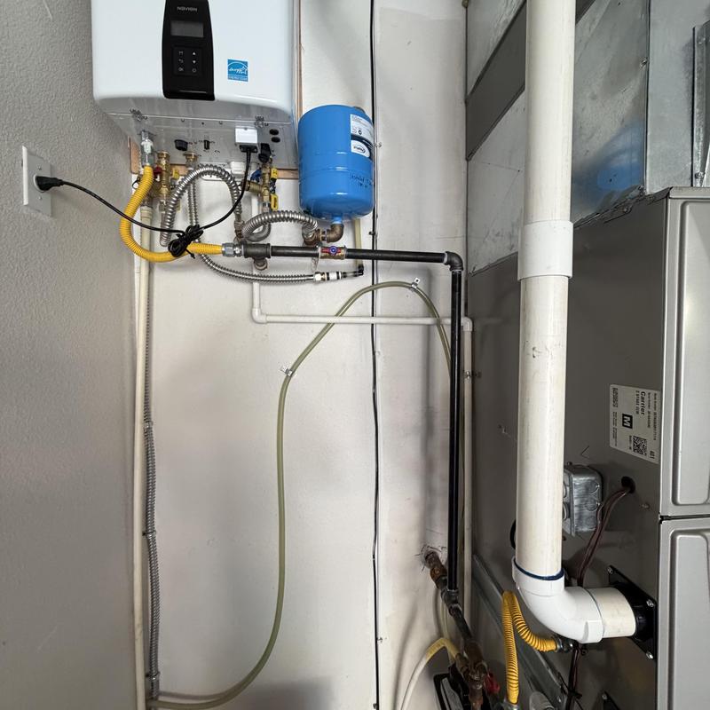 Tankless water heater drain line and expansion tank system Tankless water heater drain line and expansion tank system