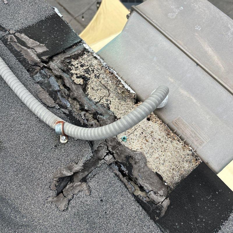 Roof edge with deteriorated sealant and flashing damage
