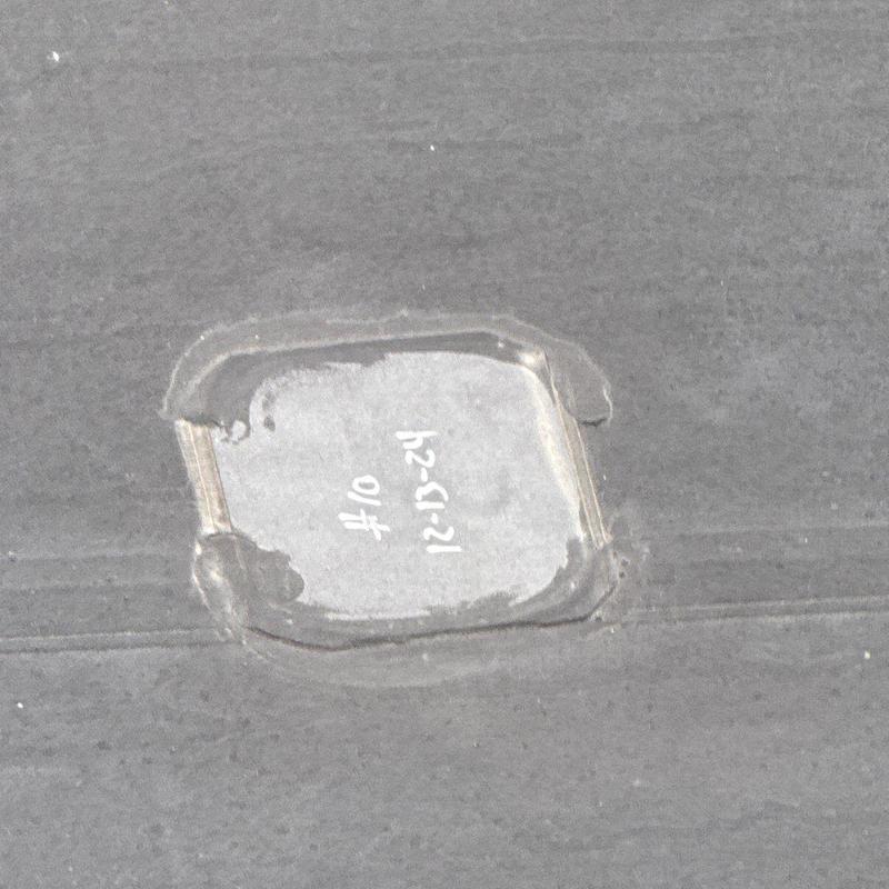 Commercial roof hail damage patch with date marking