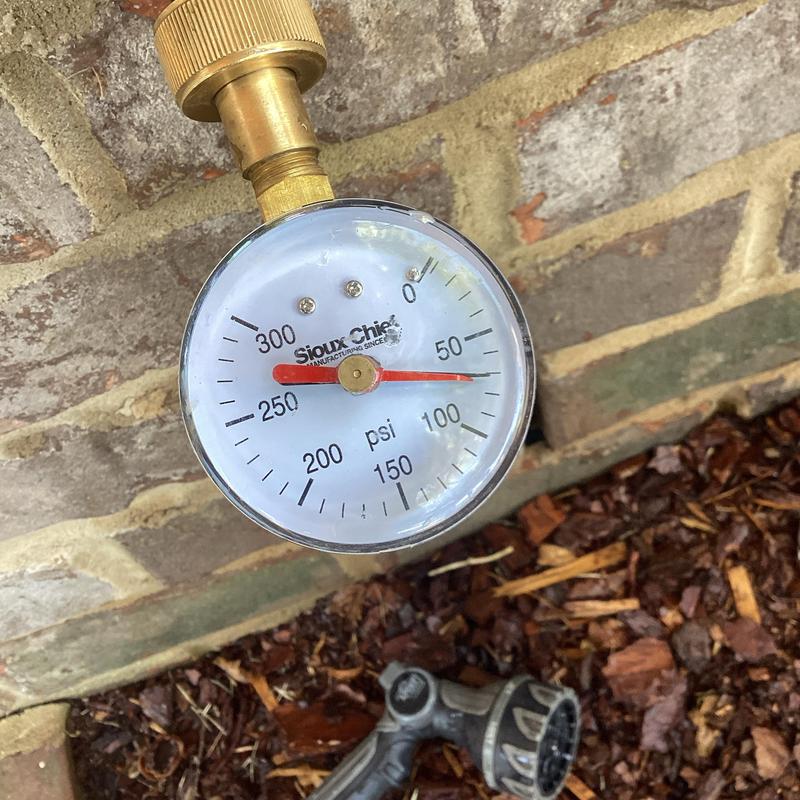 Water pressure gauge reading just above 50 psi