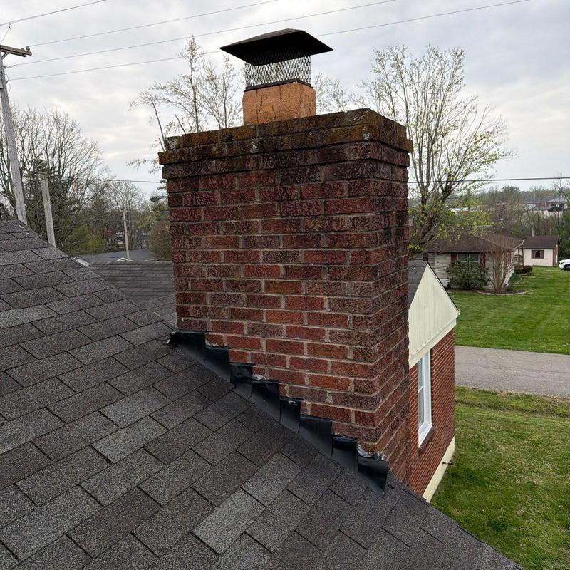 Brick chimney flashing on asphalt shingle roof