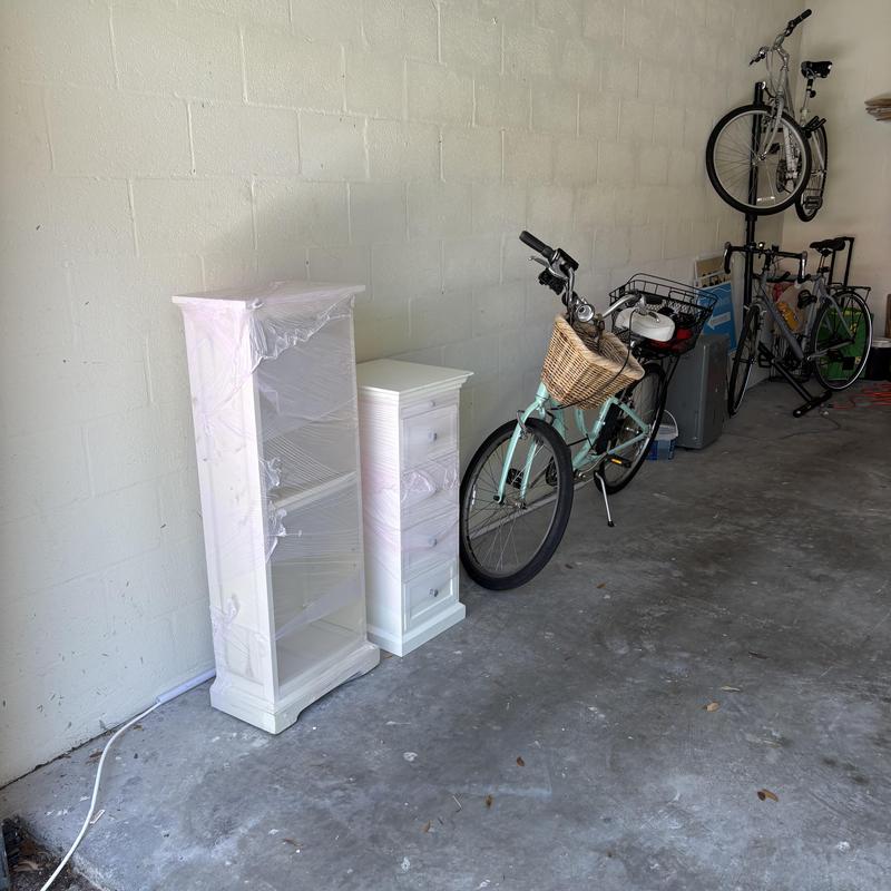 Bicycle with wicker basket and wrapped white furniture