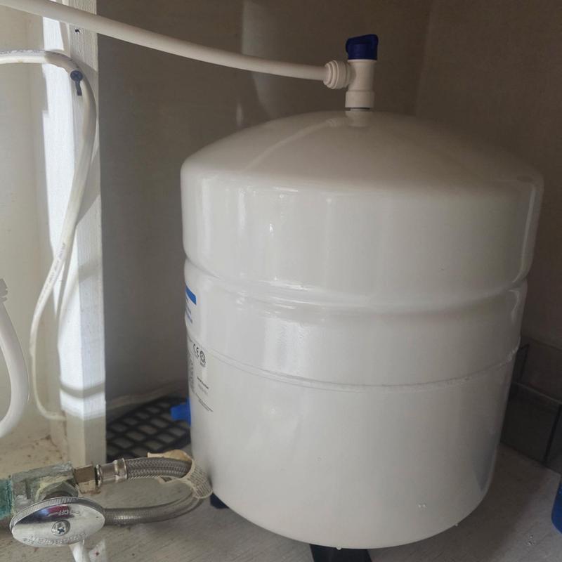RO system water storage tank with connected tubing