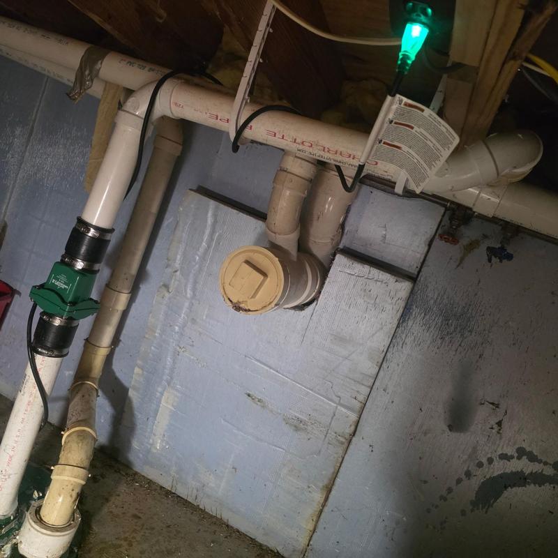Grinder pump installation with PVC plumbing pipes