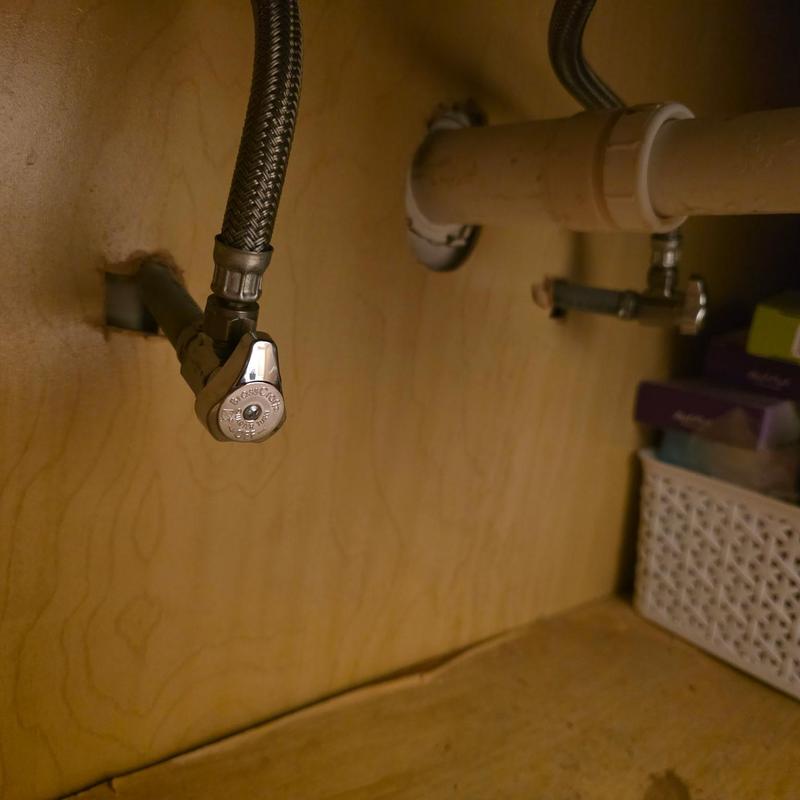 Angle stop valves under vanity with braided supply lines