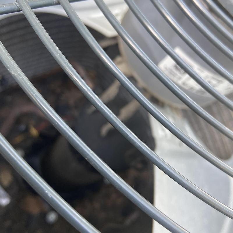 Air conditioner condenser fan guard close-up view Air conditioner condenser fan guard close-up view