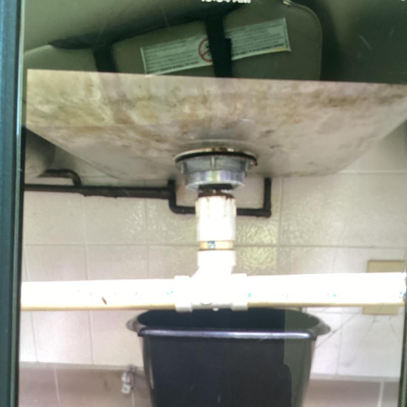 Basket strainer and PVC drain pipe assembly