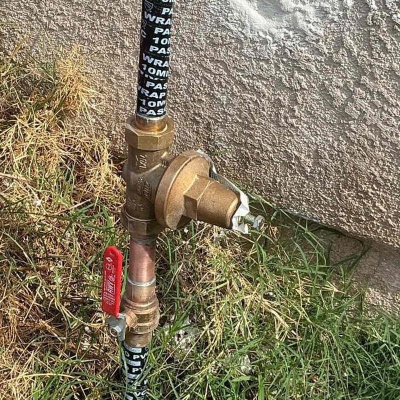 Brass hose bib with shutoff valve on outdoor wall