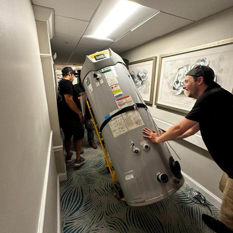 Commercial water heater removal and disposal in hallway