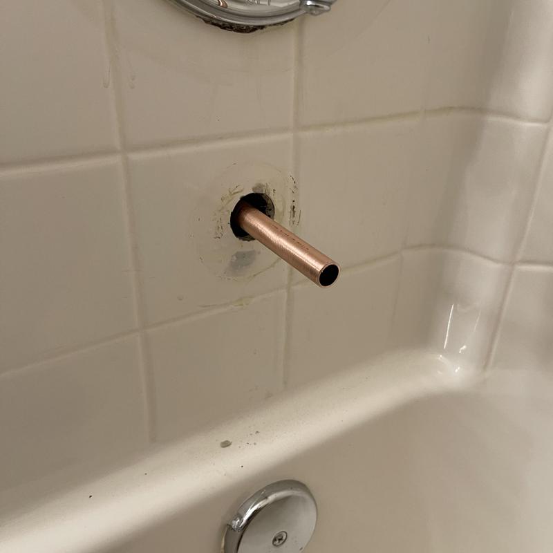 Copper bathtub plumbing stub out in tiled wall