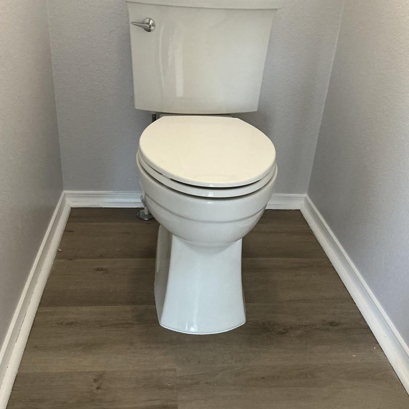 Kohler toilet installation in bathroom corner