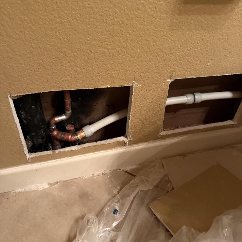 Three-quarter-inch PEX waterline behind wall manifold