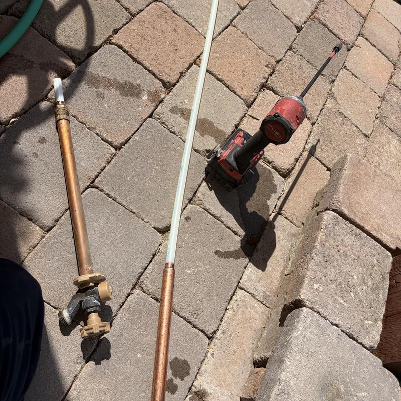 Hose bib replacements and leak test tools on pavement Hose bib replacements and leak test tools on pavement