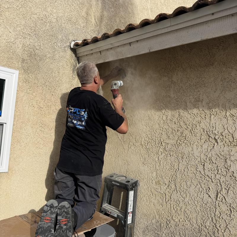Stucco wall grinding with angle grinder under eaves Stucco wall grinding with angle grinder under eaves