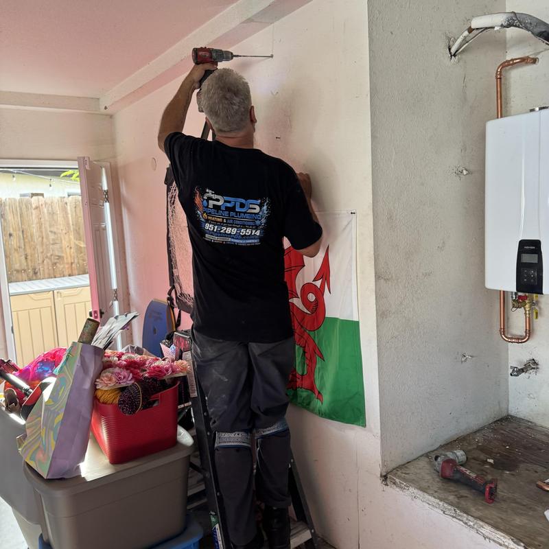 Tankless water heater installation in garage wall Tankless water heater installation in garage wall