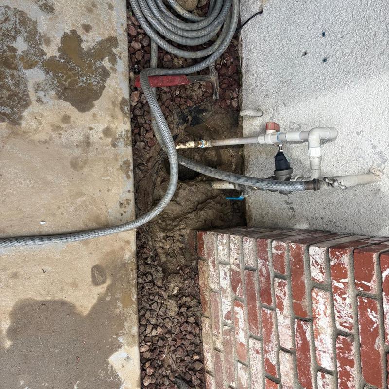 1” PVC main riser pipe with hose and valve connections outdoors 1” PVC main riser pipe with hose and valve connections outdoors
