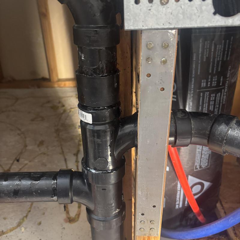 PVC drain pipe connections in indoor plumbing system PVC drain pipe connections in indoor plumbing system