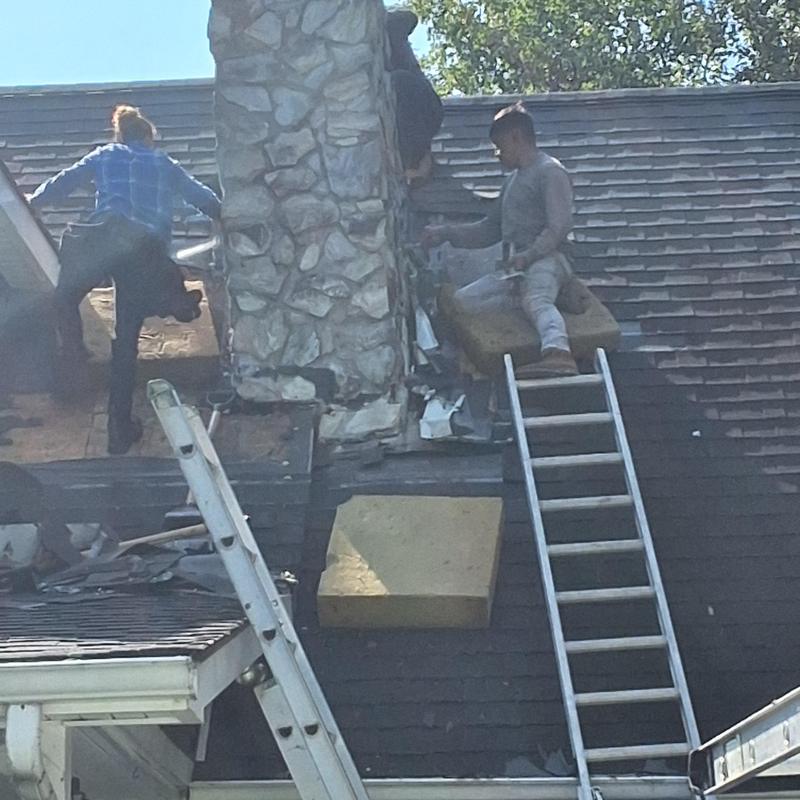 Stone chimney roof flashing repair on steep roof Stone chimney roof flashing repair on steep roof