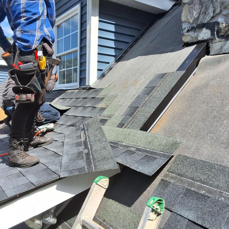 Stone chimney roof flashing repair with shingle replacement Stone chimney roof flashing repair with shingle replacement