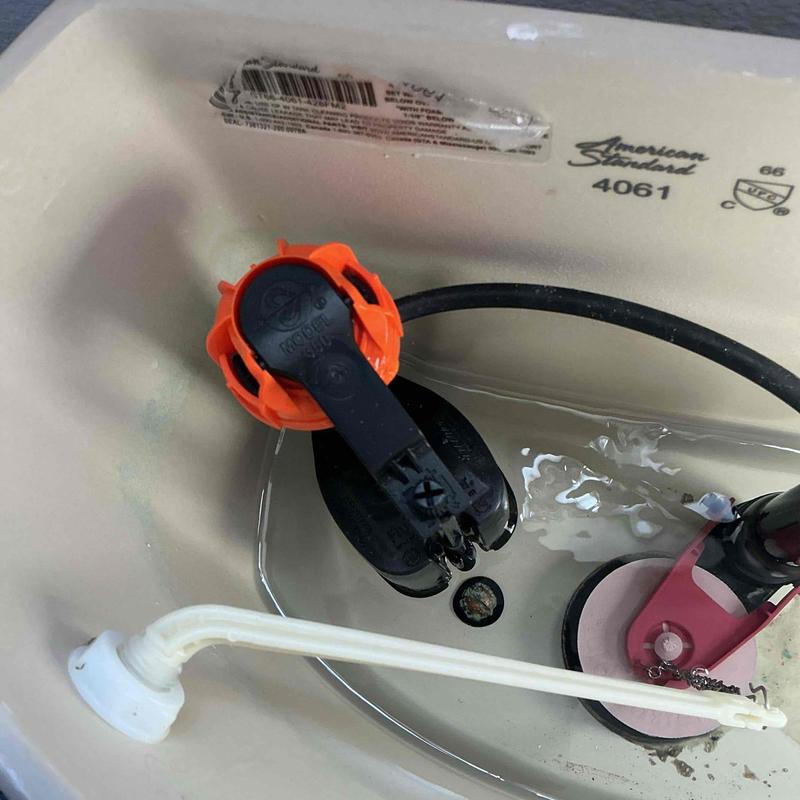 Toilet fill valve and flapper inside tank