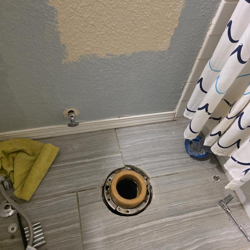 Toilet flange and wax ring with removed toilet bowl