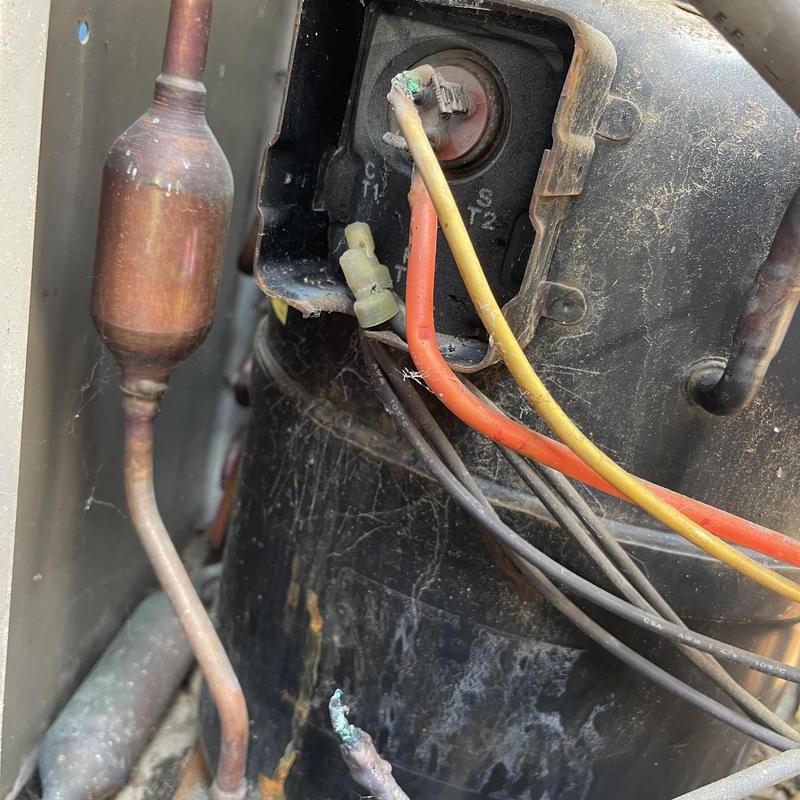 Compressor with corroded terminal and wiring connections